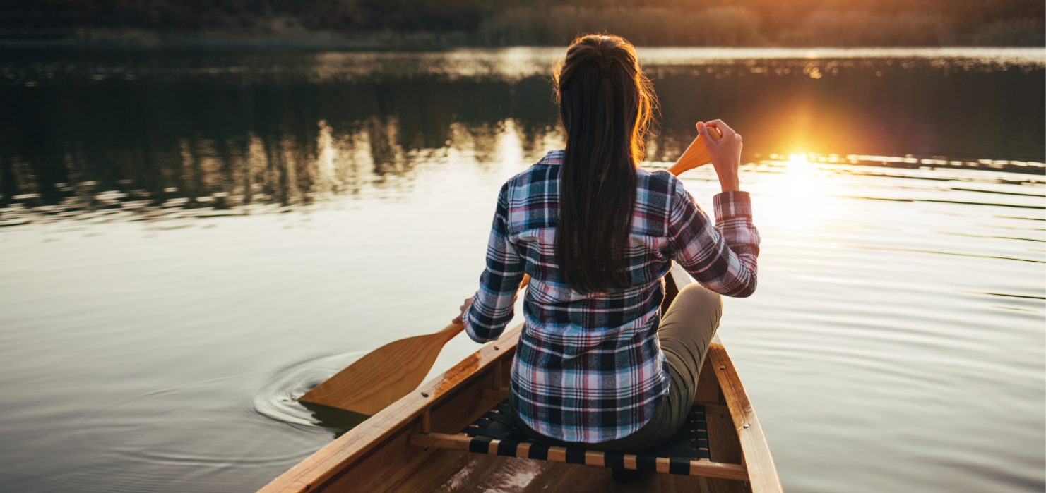 Woman rowing in boat